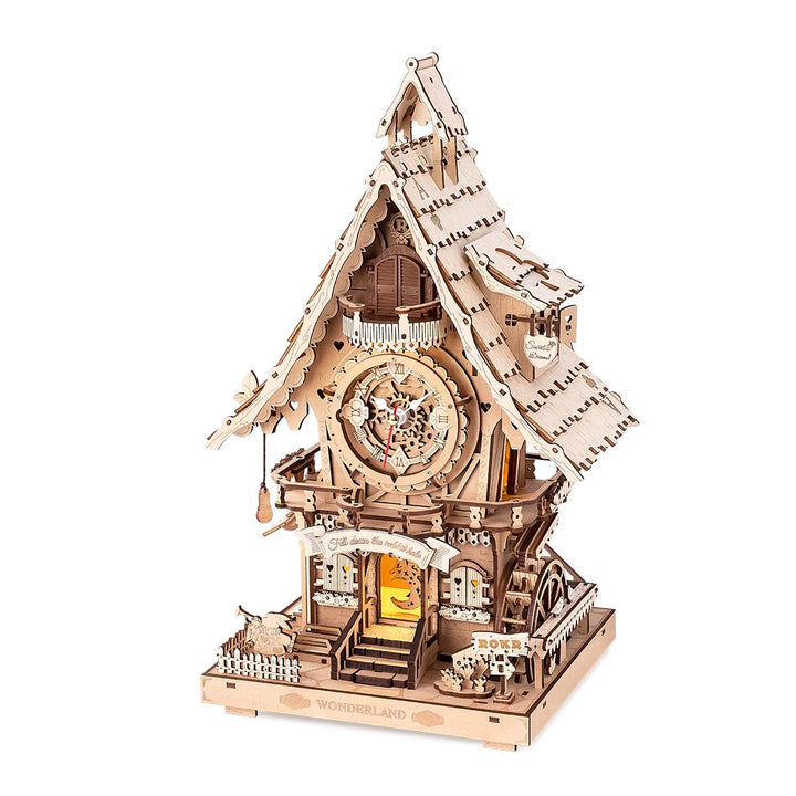 Wooden mechanical model of a clock tower on a white background