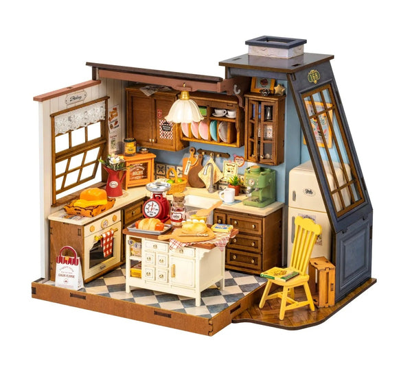 Detailed model of a miniature kitchen with furniture and appliances on a white background